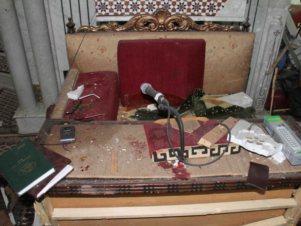 In this photo released by the Syrian official news agency SANA, the desk of Sheikh Mohammad Said Ramadan al-Buti, an 84-year-old cleric known to all Syrians as a religious scholar, is seen after a suicide bomber blew himself up at the Eman Mosque in the Mazraa district, in Damascus, Syria, Thursday, March 21, 2013. A suicide bomber blew himself up during evening prayers inside a mosque in Damascus Thursday, killing a top Sunni Muslim preacher and longtime supporter of President Bashar Assad and least 13 other people, state TV reported. Al-Buti's death is a big blow to Syria's embattled leader, who is fighting mainly Sunni rebels seeking his ouster. (AP Photo/SANA)