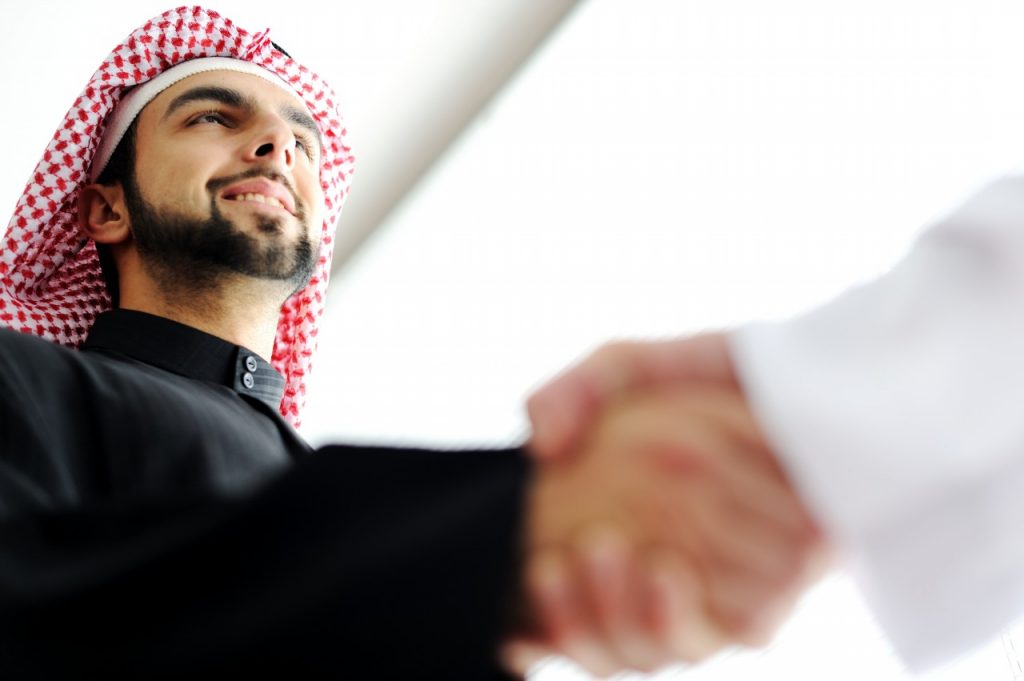 successful-arab-business-people-shaking-hands-over-a-deal